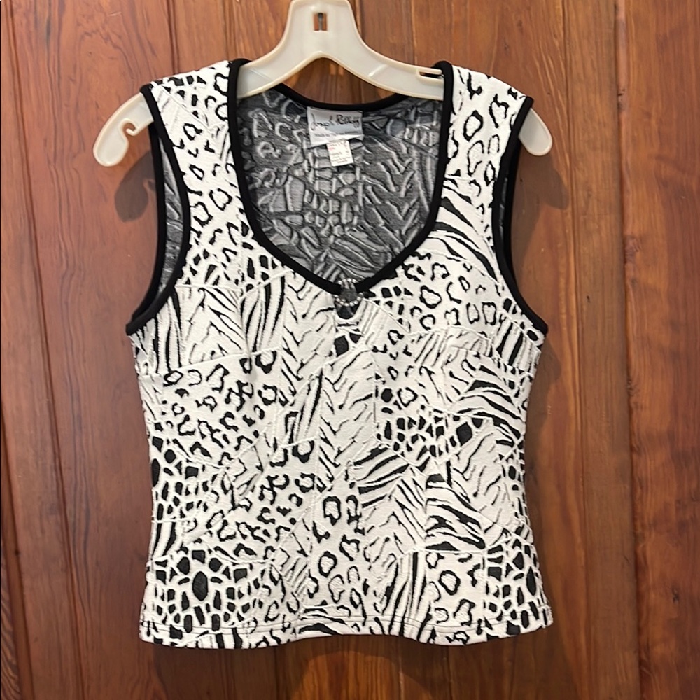 Black and white sleeveless Joseph Ribkoff Polyester and Spandex. Worn twice